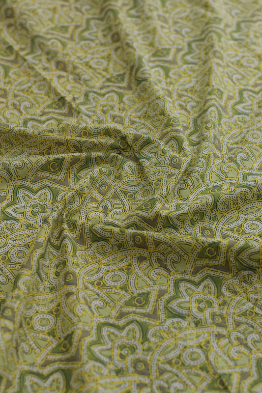 Green fabric with intricate paisley pattern