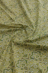 Green fabric with intricate paisley pattern