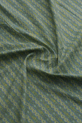 Close-up of patterned fabric in green and blue.