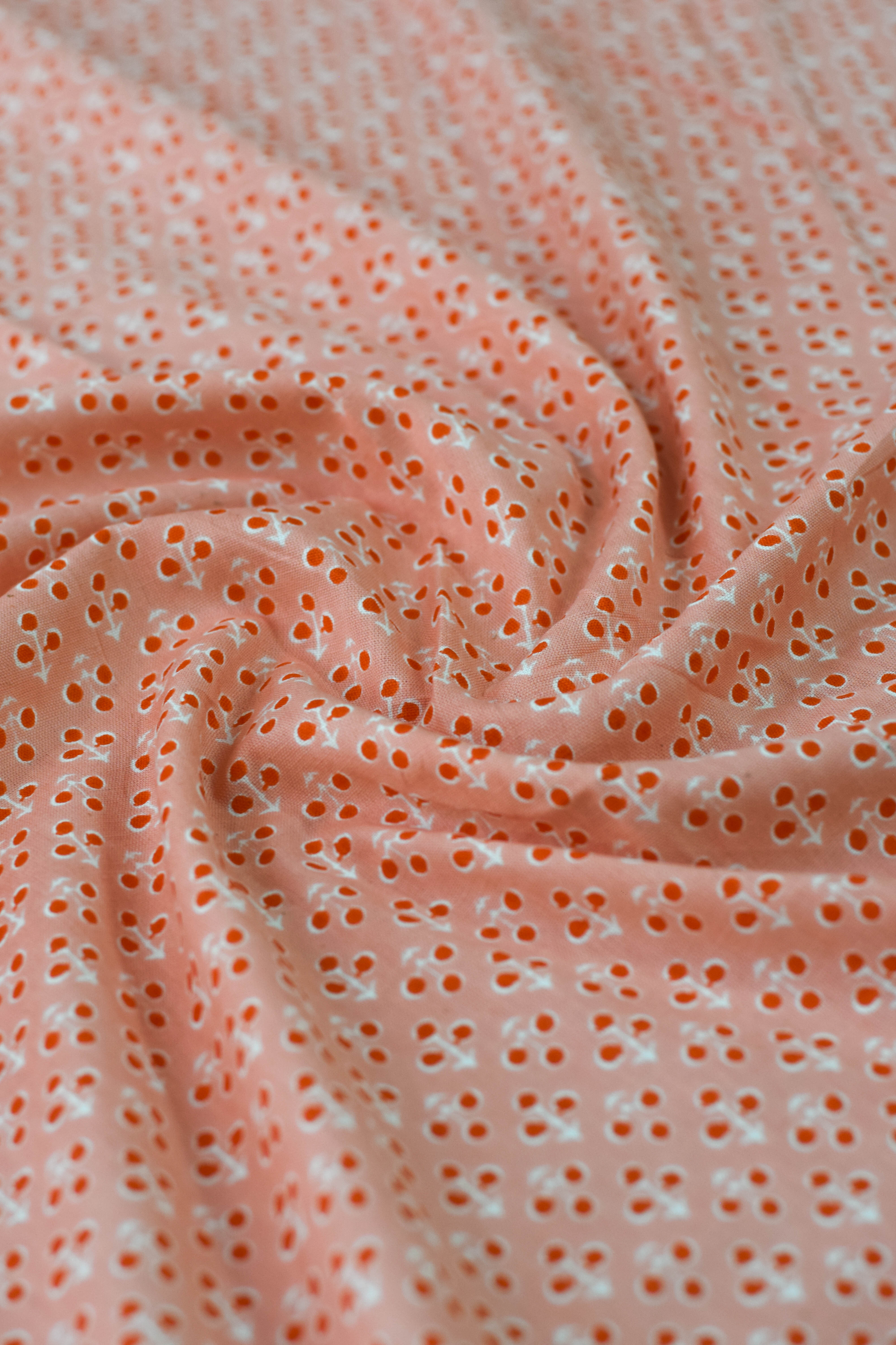 Close-up of pink fabric with small holes or pores.