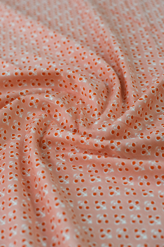 Close-up of pink fabric with small holes or pores.