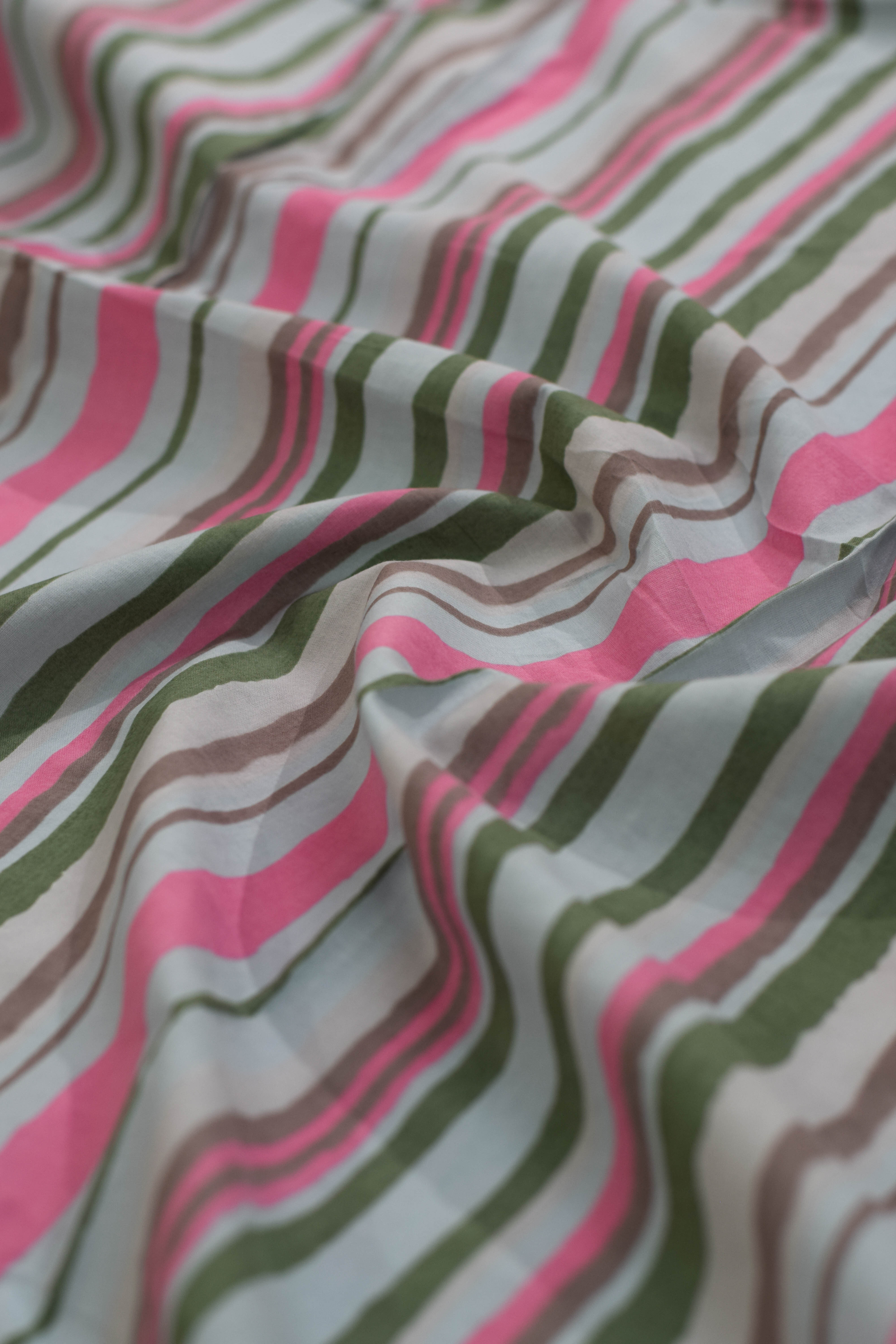 Striped fabric with pink, green, and brown colors.