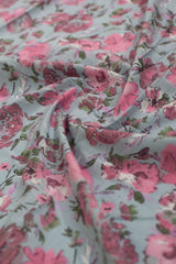 Floral patterned fabric with pink and green colors.