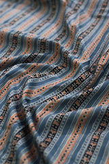 Close-up of patterned fabric with blue and brown tones