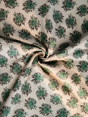 Fabric with green floral pattern on beige background
