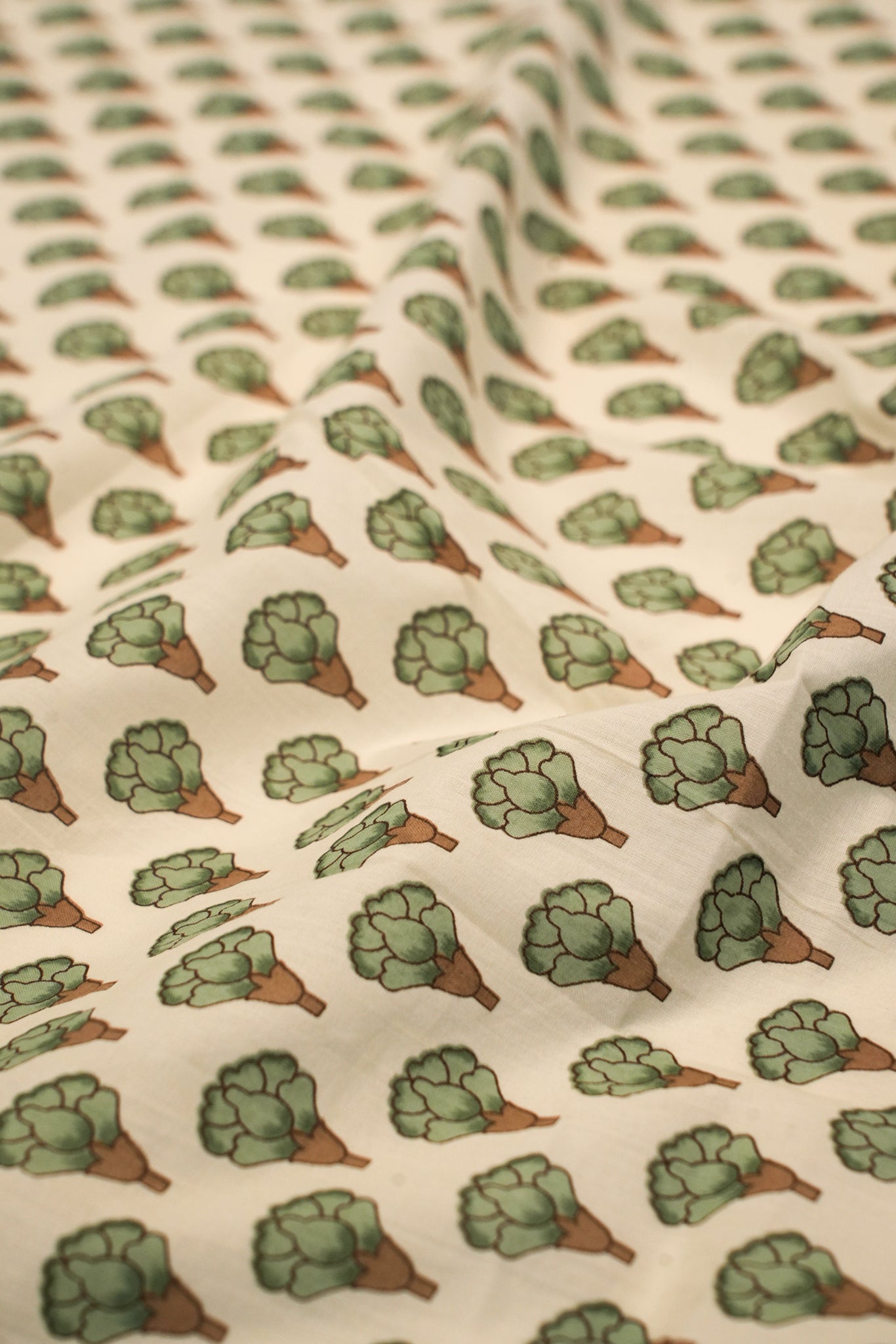 Pattern of green and brown flowers on a beige background