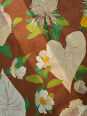 Floral and leaf pattern on a brown background