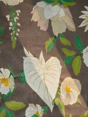 Floral pattern with white and green flowers on a brown background