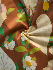 Close-up of floral fabric with brown background