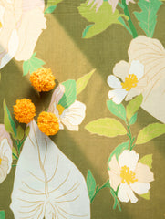 Close-up of a floral pattern white leaves on a olive background
