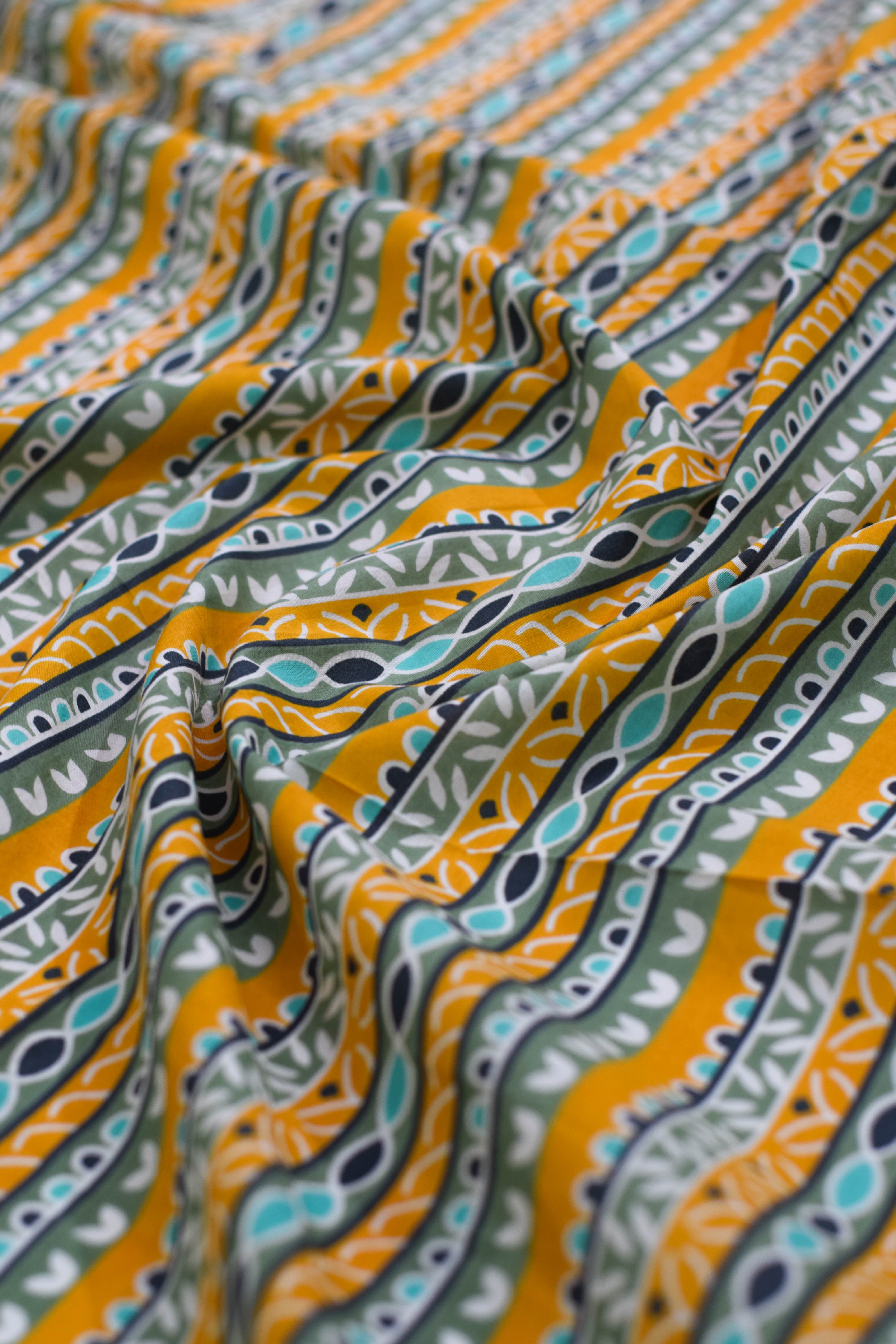 Close-up of patterned fabric with orange and green design