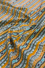 Close-up of patterned fabric with orange and green design