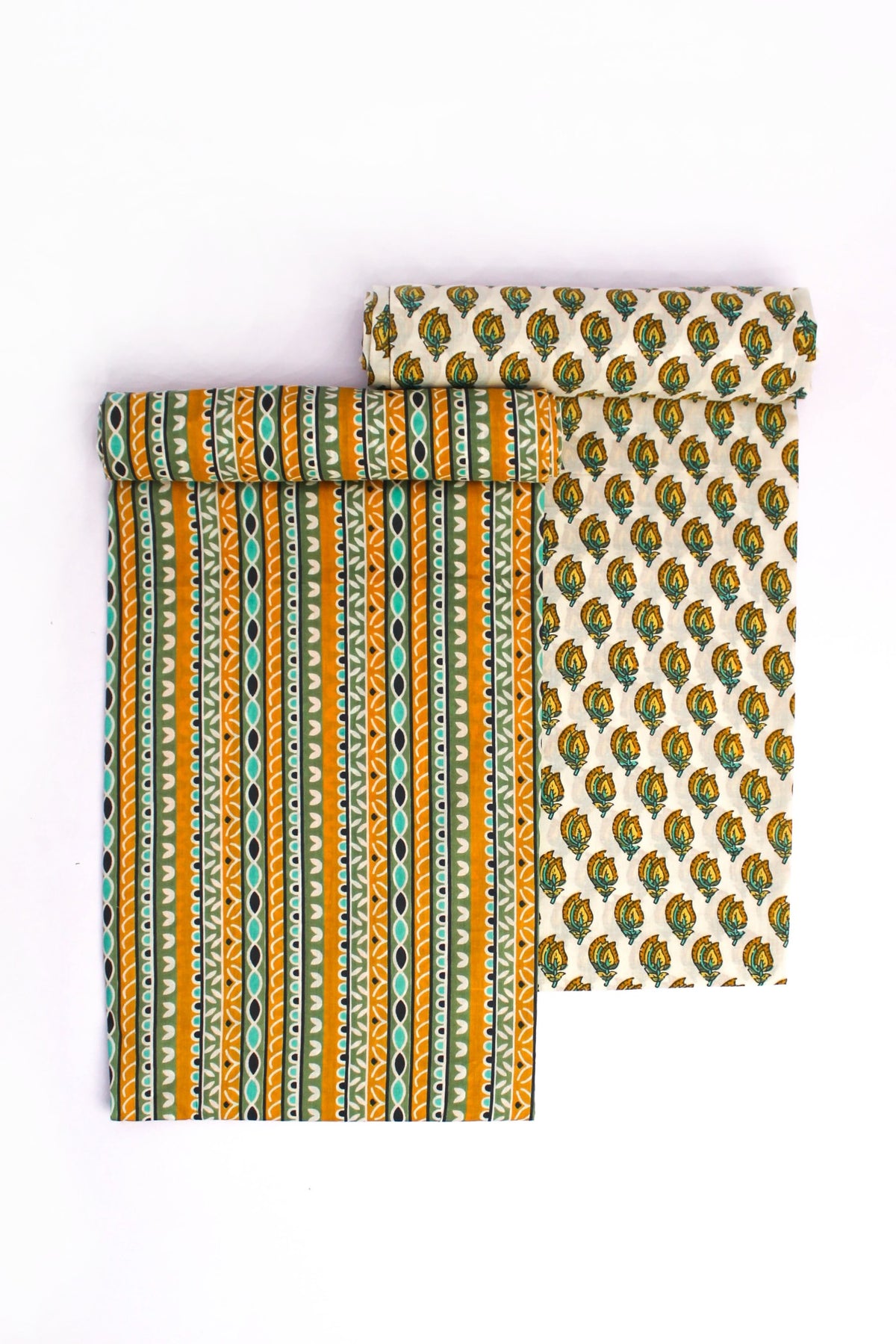 A two-piece suit set with one piece showcasing a striped pattern with vertical teal and mustard lines and the other with a mustard floral motif on a darker background.