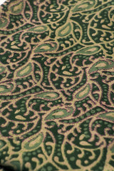 Close-up of a green and beige patterned fabric