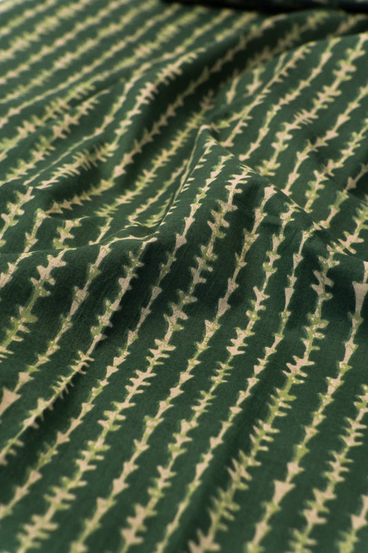 Close-up of green fabric with a subtle pattern
